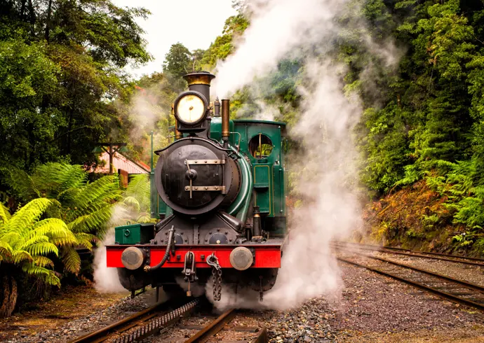 A green steam train on the West Coast Wilderness Railway between Queenstown and Strahan, Tasmania